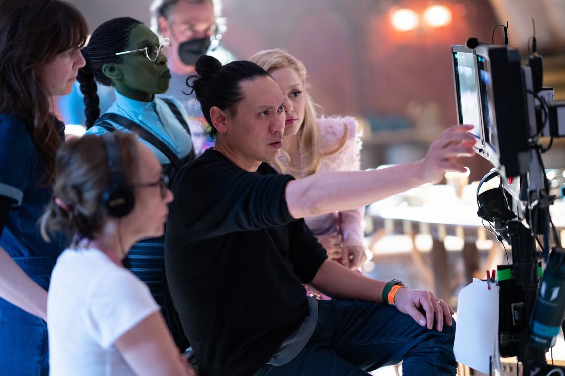 Film director John M. Chu behind the scenes of Wicked, a 2024 film.