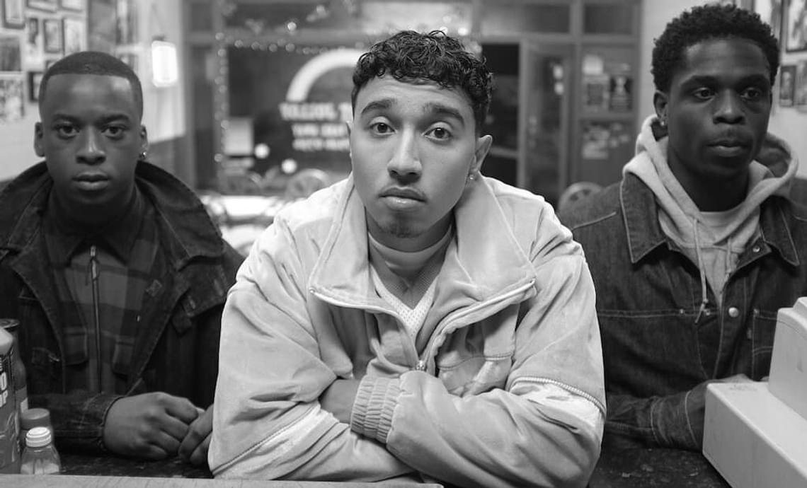 Still from Pirates. Three young men look directly at the camera.