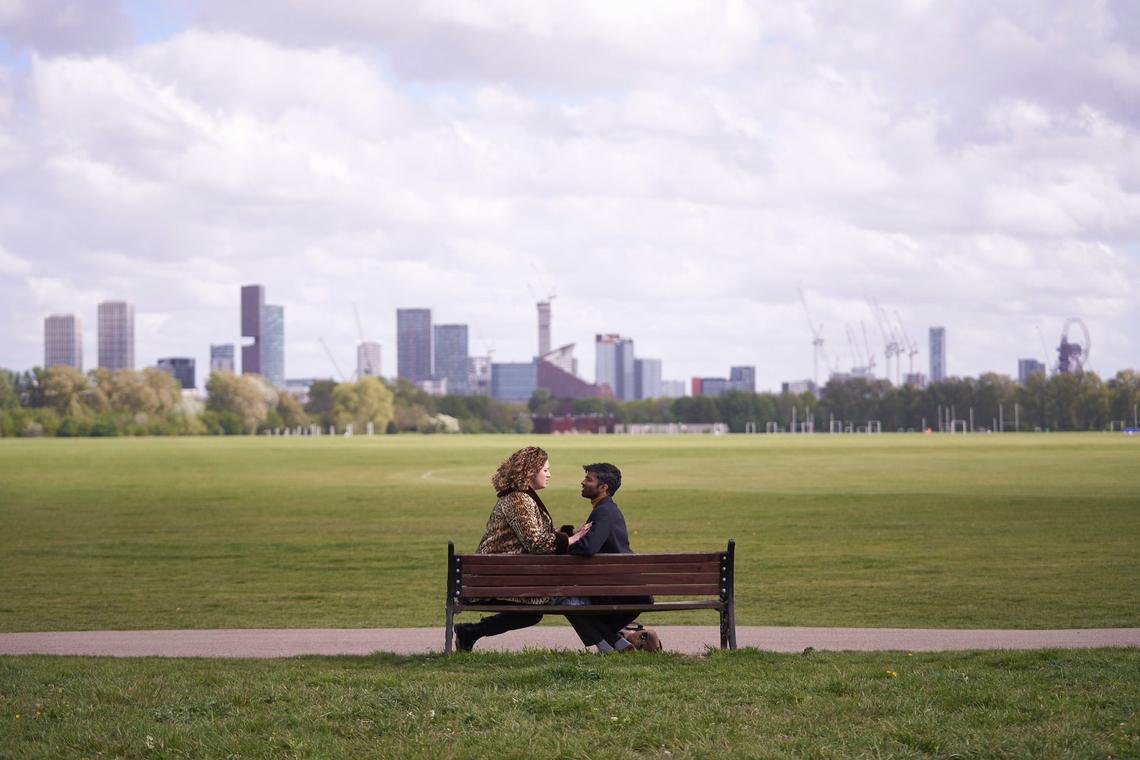 Still from Starstruck season 3, Rose Matafeo and Nikesh Patel on a London park bench overlooking the city skyline
