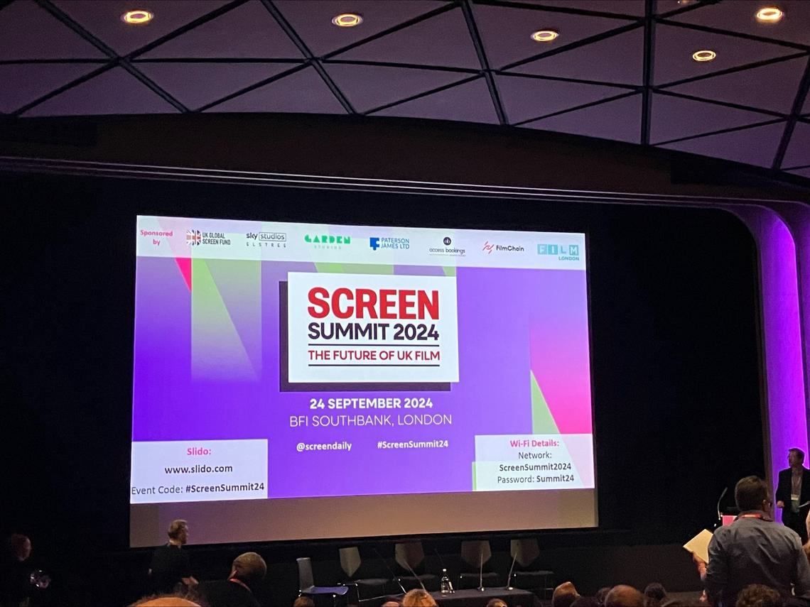 Cinema screen showing opening slide introducing the event