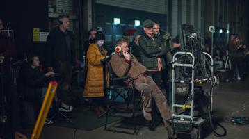 Guy Ritchie behind-the-scenes of The Gentlemen (2023). Christopher Rafael/Netflix Copyright © 2023, Netflix Inc.