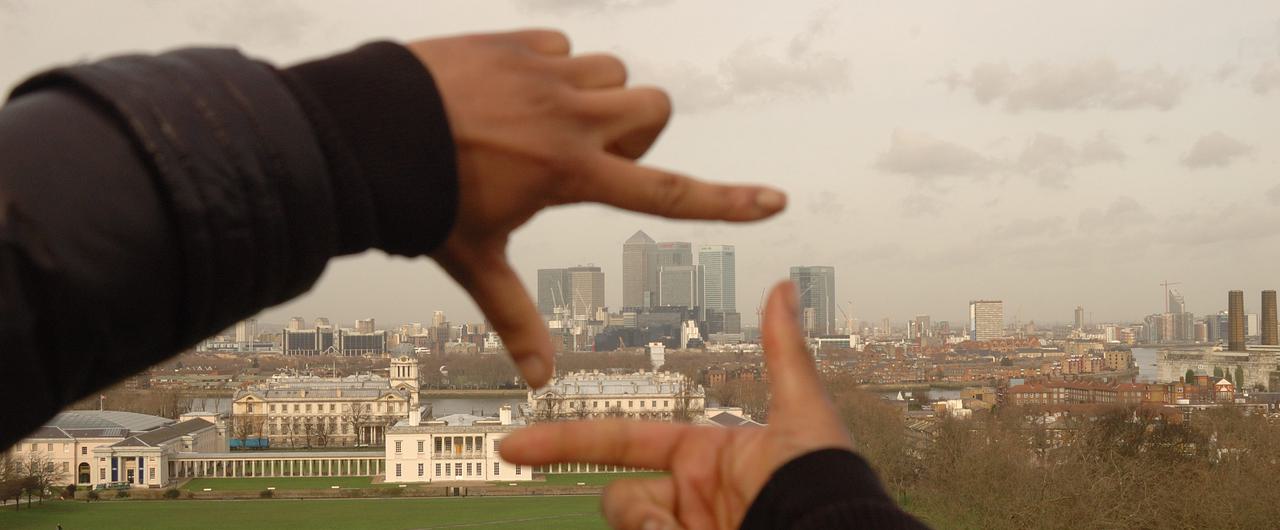 London skyline framed by two hands