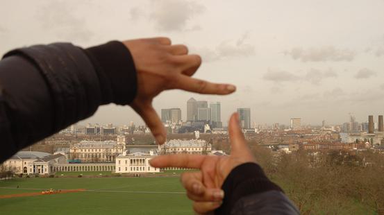 London skyline framed by two hands